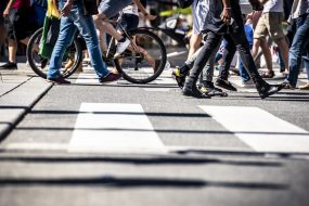 People on pedestrian crossings, on foot and by bicycle