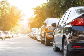 Black car parking in line outdoor